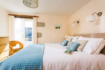 The ground floor double bedrooms have doors out onto the central courtyard.