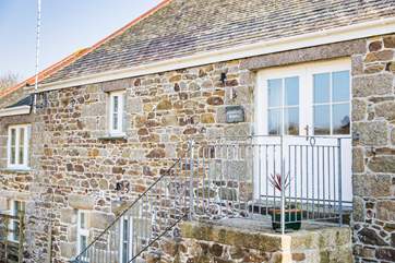 The entrance to Wallis Barn is up a stone flight of steps.
