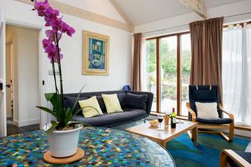 The large windows in the living-area really let the light flood in.
