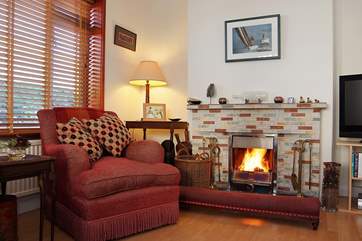 The sitting-room is very comfortably furnished.