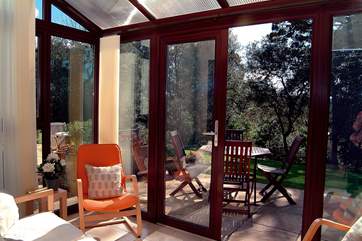 The conservatory opens onto the south-facing patio.