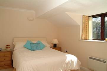 The master bedroom has a king-size bed (Bedroom 2).
