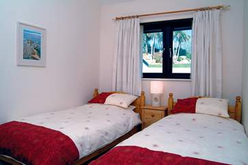 The second bedroom has twin beds (Bedroom 1).