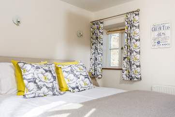 The cottage has been furnished with beautiful fabrics.