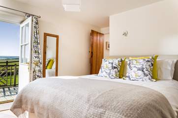 The double bedroom is located at the opposite end of the cottage to the living-room.