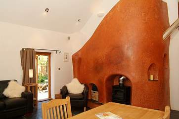 The sitting/dining-room with a door directly to the patio and garden.