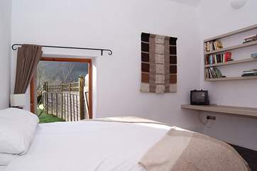 This is the ground floor bedroom with its king-sized bed and doors directly out to the garden,