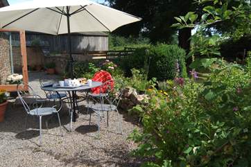 Another view of the outside sitting-area. There is a lawn too.