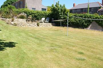 The large garden is just 10 yards from Pebble Cottage and has a badminton/volleyball net for fun and games.