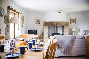 The large open plan living-room with sitting and dining areas.
