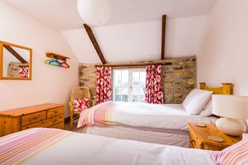 A comfy room for adults or children, with views over the courtyard.