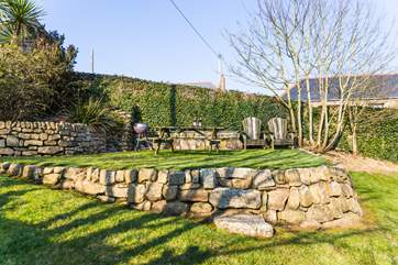 The garden is a short walk across the courtyard and has space to play and space to dine outside.