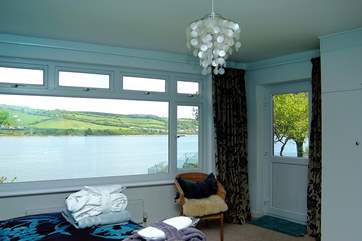 Bedroom 2 has water views as well as a door to the lower deck.