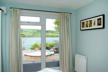 Bedroom 4 has a door to the deck and an en suite WC and wash-basin.