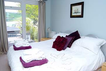 Bedroom 5 has a door to the deck and an en suite WC and wash-basin.