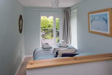 Bedroom 1 has doors out to its own deck