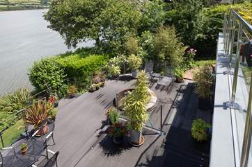 Looking down on the lower deck with the hot tub and magnificent views up and down river.