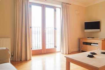 French doors open onto a Juliet balcony with wonderful views across the water to Flushing.