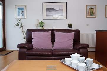 The living-room is very comfortable, with a door straight onto the patio.