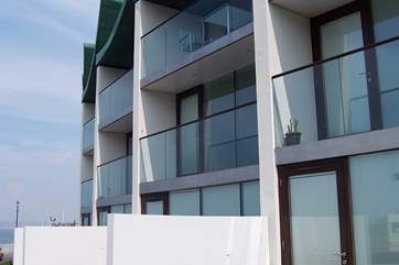 Each of the ground floor apartments has a sea facing patio.