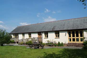 The cottage looks over a spacious garden.