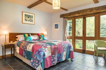 French doors from the second bedroom lead out to the garden.
