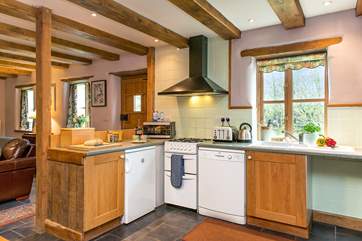 The kitchen enjoys views across the garden.