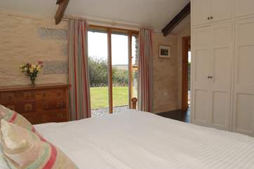 The bedroom is light and airy