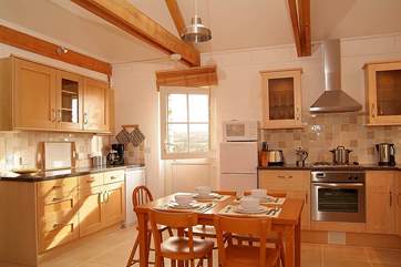 A stable-door leads from the kitchen-area out to the patio and back garden.