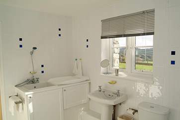 The en suite bathroom has a purpose-built baby bath and shower unit.