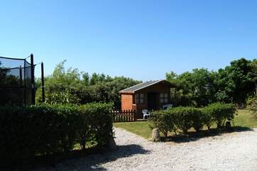 There is an outside decked area by the cottage and the shared children's play-area is just a few yards away.