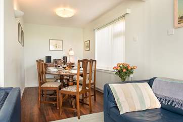 At one end of the sitting-room there is another dining-area.