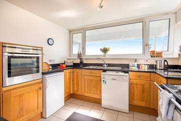 The kitchen is very well-equipped and of course takes in the view.
