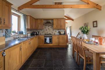 The kitchen/diner with steps down to the sitting-room.