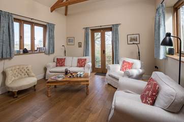 The sitting-room leads out to the sun-drenched patio where you can listen to the wildlife.