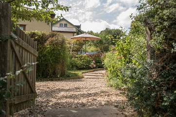Welcome to the beautifully manicured terrace gardens and patio leading up to Larkworthy Cottage.