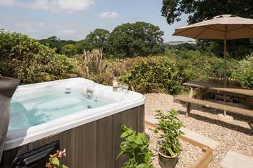 Take a soak in the hot tub after a day exploring the countryside - enjoying those fabulous countryside views.