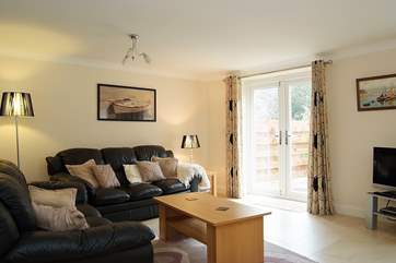 The sitting-area looks out over the large, landscaped garden.