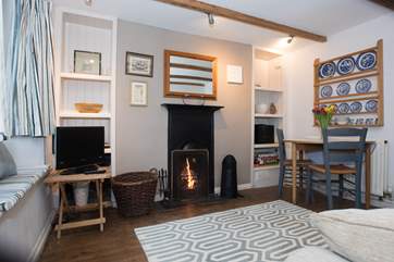 The sitting-room has a roaring open fire.