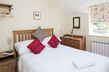 The en suite bedroom, bedroom 2 has views over the village to the countryside beyond.