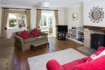 This cheerful room opens out into the conservatory, the wood-burner effect electric fire gives a cosy feel in winter. Lots of games and DVD's so that all the family can join in.