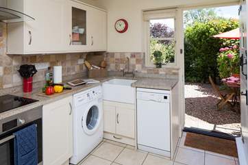 The kitchen door opens onto the private courtyard garden.