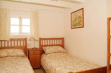 The cosy twin bedroom is also on the ground floor (Bedroom 2).