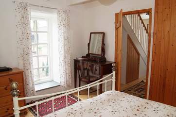 The double bedroom is light and comfortably furnished.