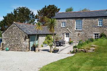 Little Trebarvah's south-facing garden is a peaceful spot from which to admire the countryside views.