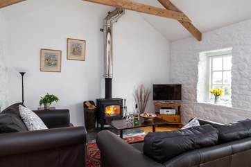 Sink into the sofas in front of the wood burner.
