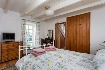 The master bedroom has doors that open to the private patio.