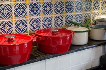 Pots and pans above the Aga.