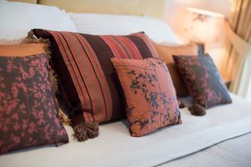 Gorgeous silk cushions dress the bed (all bed linen is from The White Company).