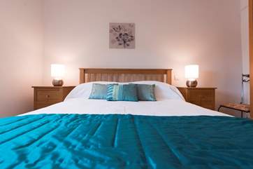 A super-comfortable king-size bed (5') in Bedroom 1.
